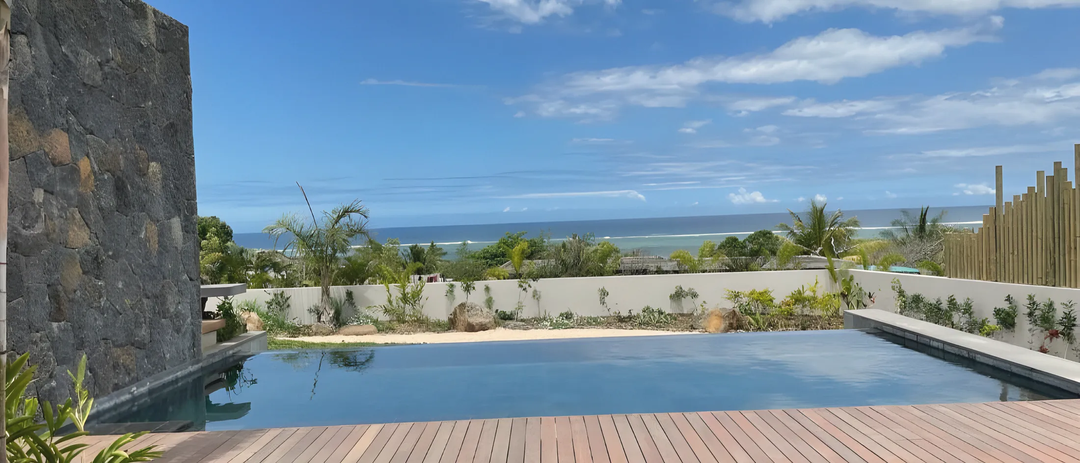 The infinity pool and teak deck above the Indian Ocean