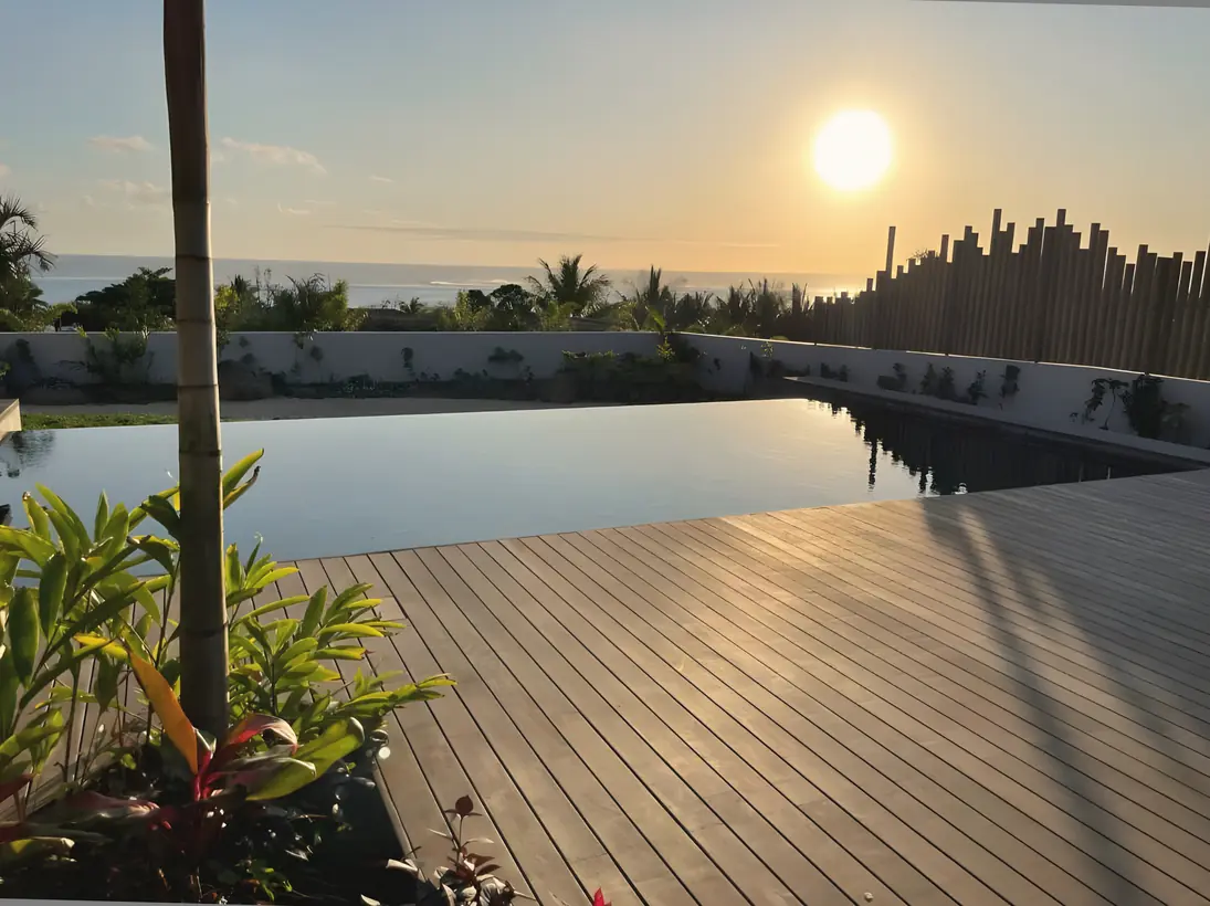 The sun setting over the infinity pool